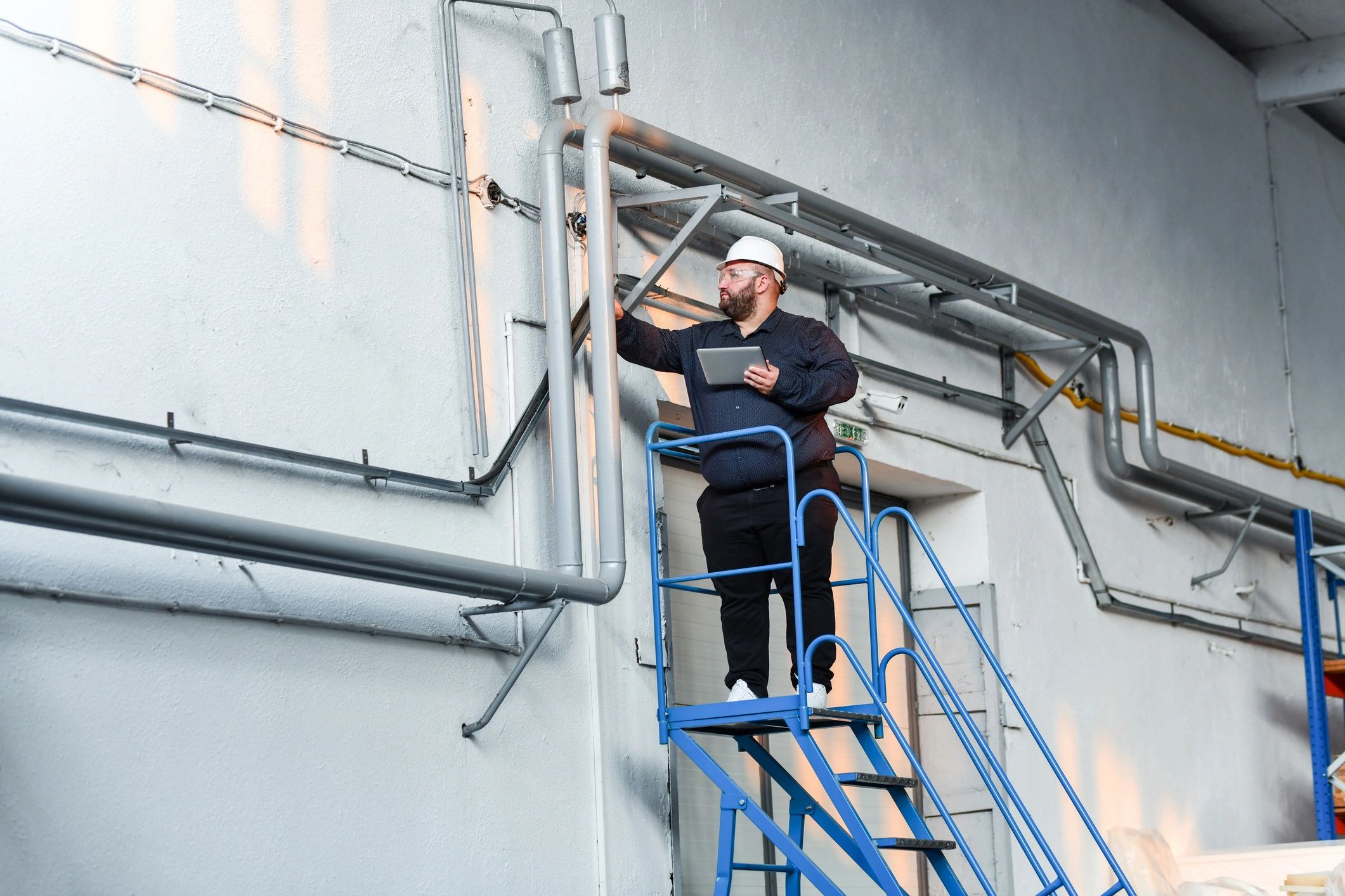 Maintenance foreman reviewing pipe status, representing preventive maintenance