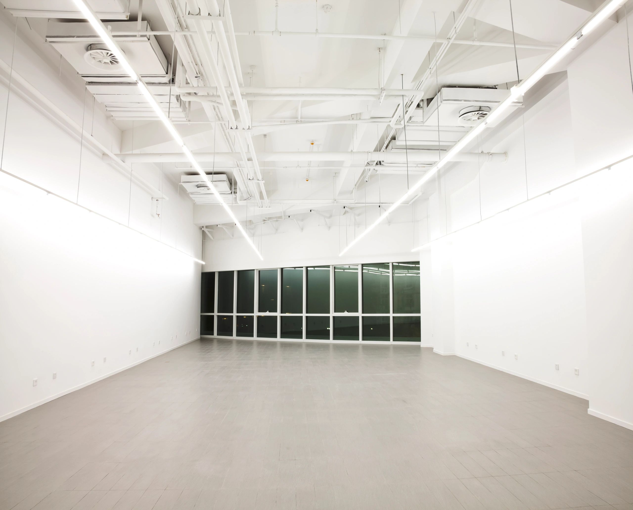 Office ceiling showing smoke detector and sprinkler system
