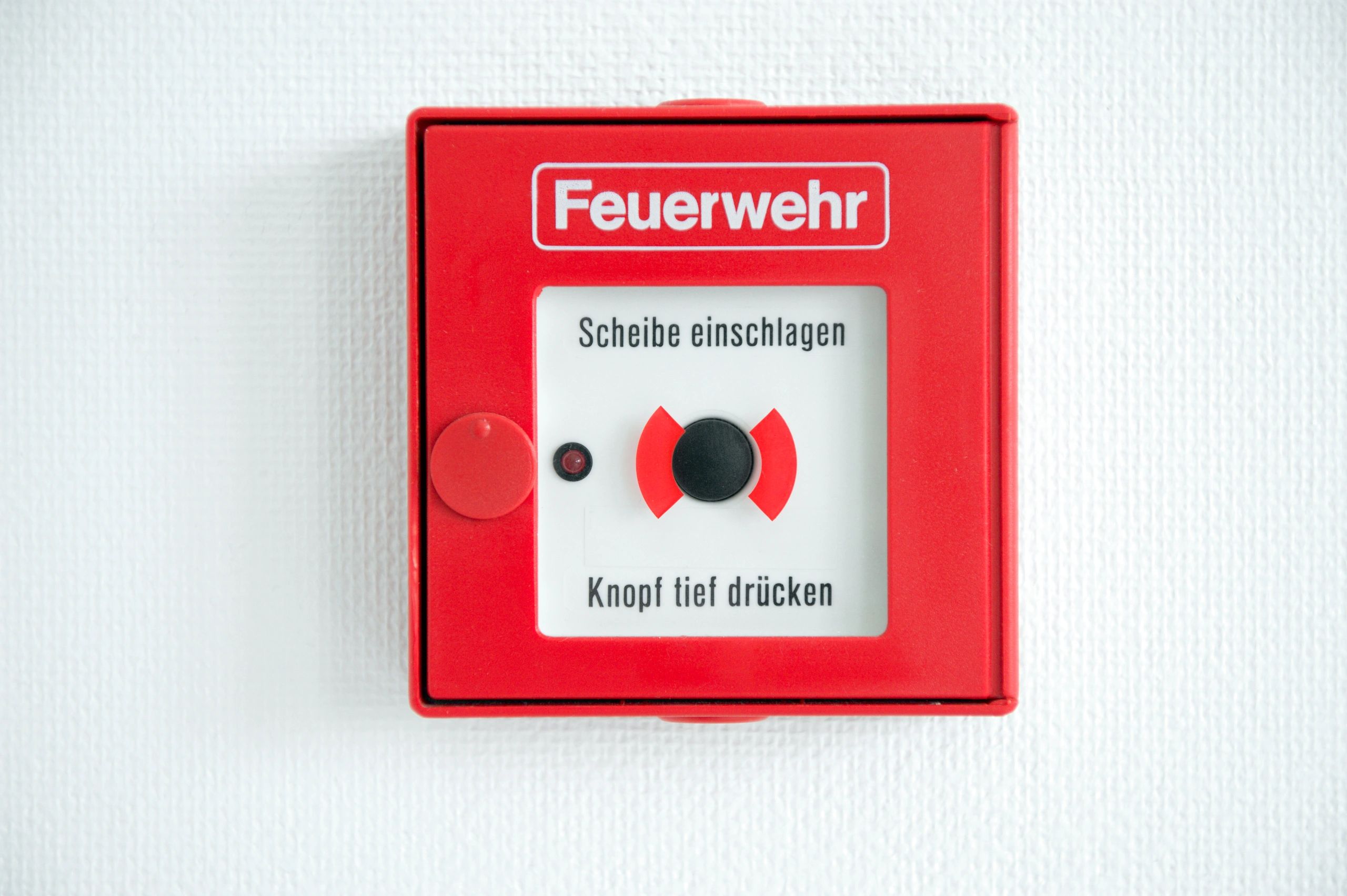 Fire alarm call point box mounted on a wall