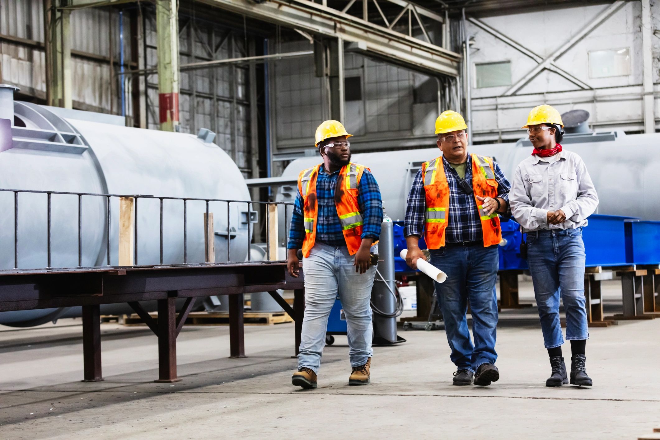 Team walking through a factory floor during an inspection